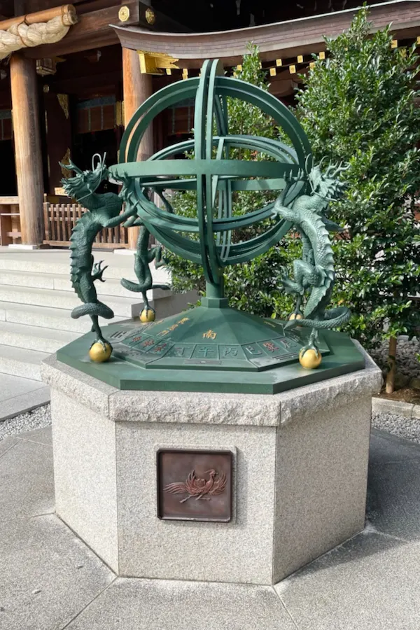 Bronze Kontenki monument with dragon figures at Samukawa Shrine, representing the shrine’s Happo-yoke (protection from all directions)